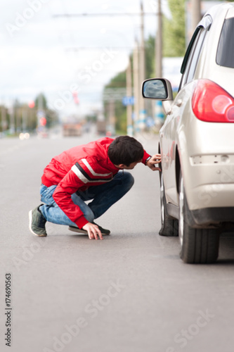 Wallpaper Mural Male driver having car troubles on cityroad Torontodigital.ca