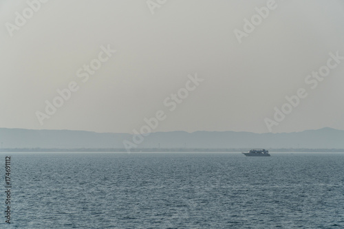 A sailing yacht under way on tropical sea