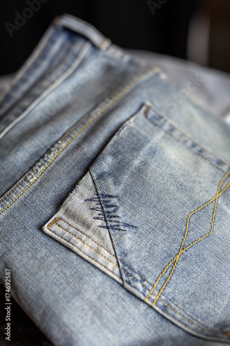 Details of blue jeans in zipper, pockets