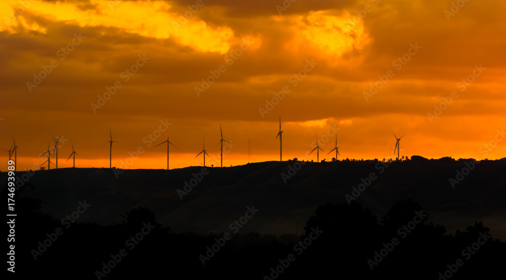 Electric turbine on the mountain at sunset