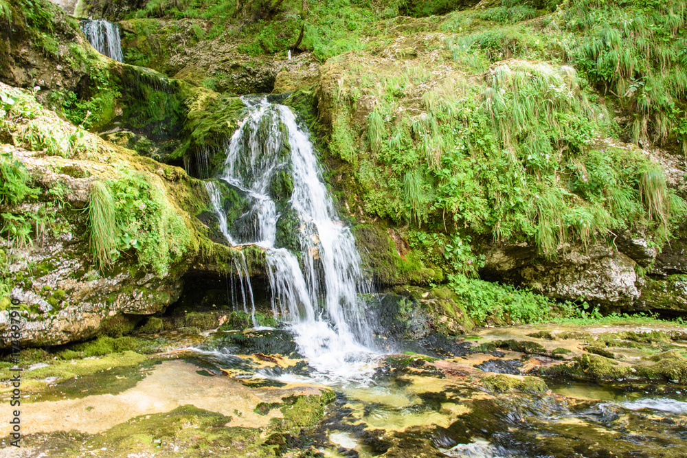 Dreamy waterfall and small emerald pond. Karst water. Fontanon of Goriuda. Friuli Dreamy waterfall and small emerald pond. Karst water. Fontanon of Goriuda. Friuli