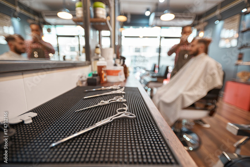 Close up of hairdresser equipment in the barbershop © Adamov