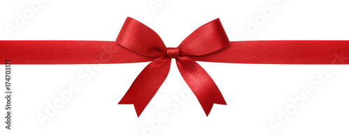 Red ribbon with bow isolated on white background. photo