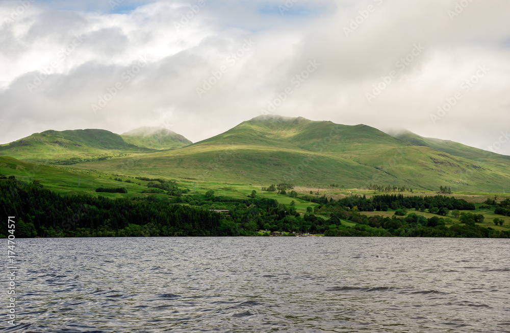 Clouds on highlands at Loch Tay scenic coastline in Scotland