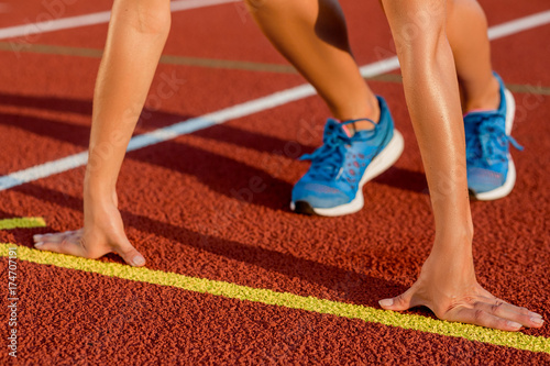 Close-up of woman's legs on start before jogging