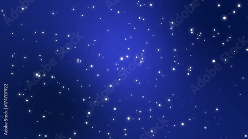 Starry night sky animation made of sparkly light star particles moving across a dark blue background.