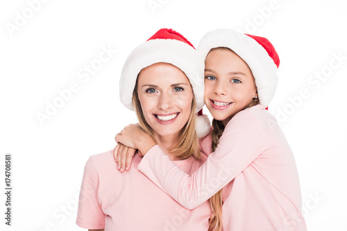 mother and daughter hugging on christmas