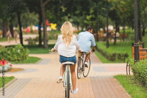 Wallpaper Mural couple riding bicycles in park Torontodigital.ca