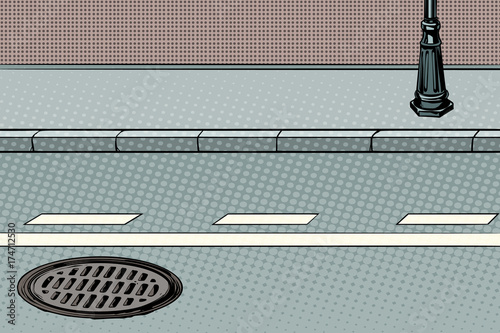 City street with sidewalk and manhole