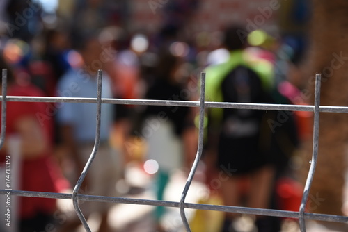 diffused metal fences with young people 