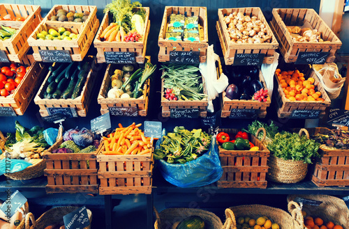 Fototapeta Naklejka Na Ścianę i Meble -  vegetables and fruits in wicker baskets in greengrocery