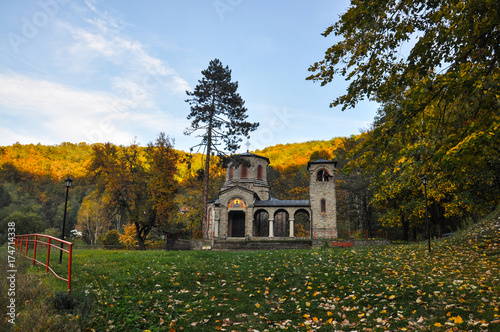 Small orthodox church in Vucje, Serbia. Small old church in autumn photo