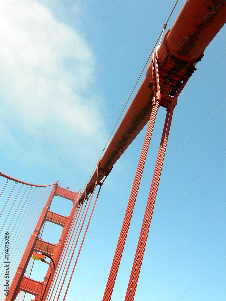 Red cables of the famous golden gate bridge in San Francisco with blue sky as background, USA. Red cables of the famous golden gate bridge in San Francisco with blue sky as background, USA.