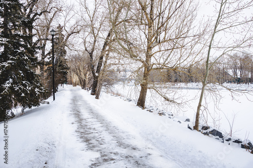 Riverside Path Covered in Snow on a Freezing Winter Morning. Calgary, Canada © alpegor