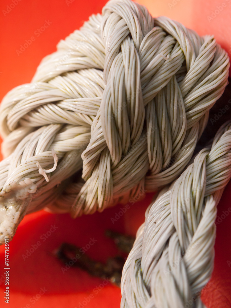 tight tied roped knot close up holding in place