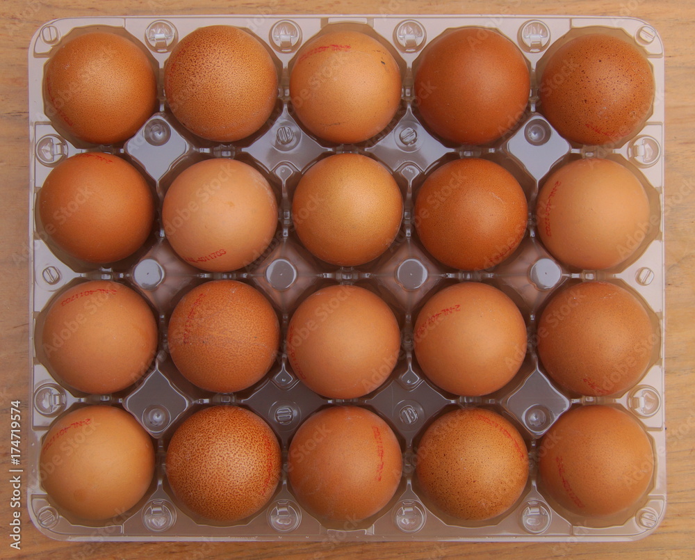 Fresh chicken eggs in plastic package - background Fresh chicken eggs in plastic package - background