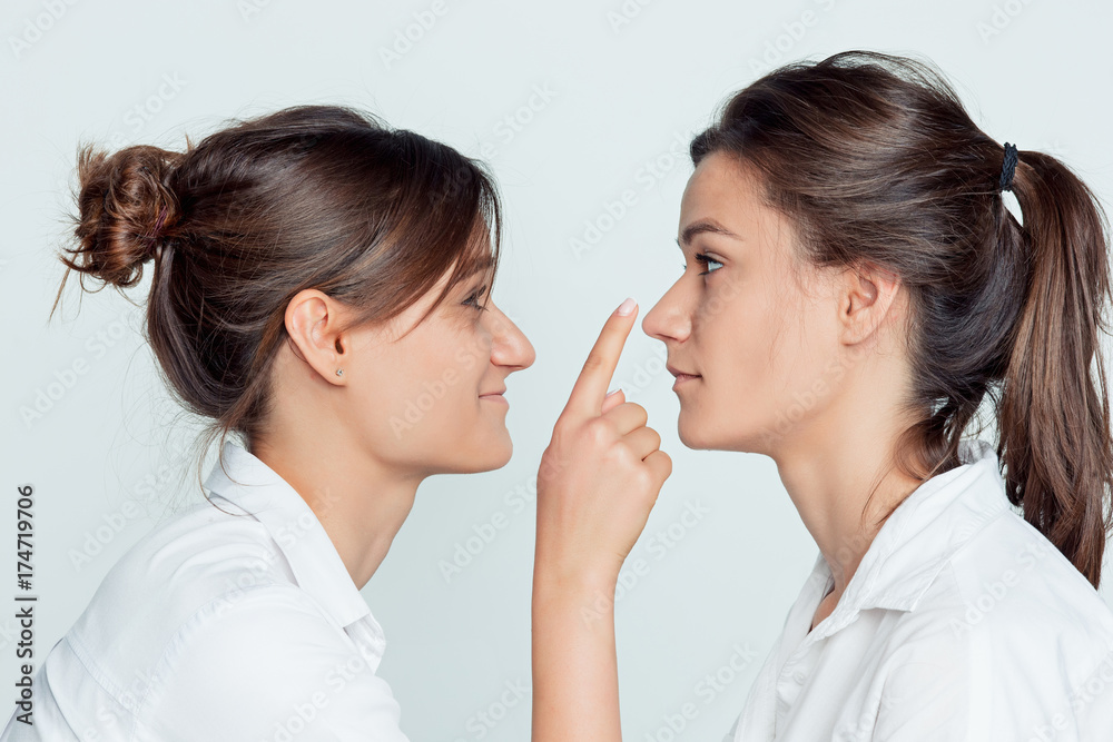 Studio portrait of female twins