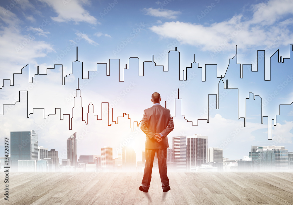 Motivation and inspiration concept with modern cityscape and businessman observing it Motivation and inspiration concept with modern cityscape and businessman observing it