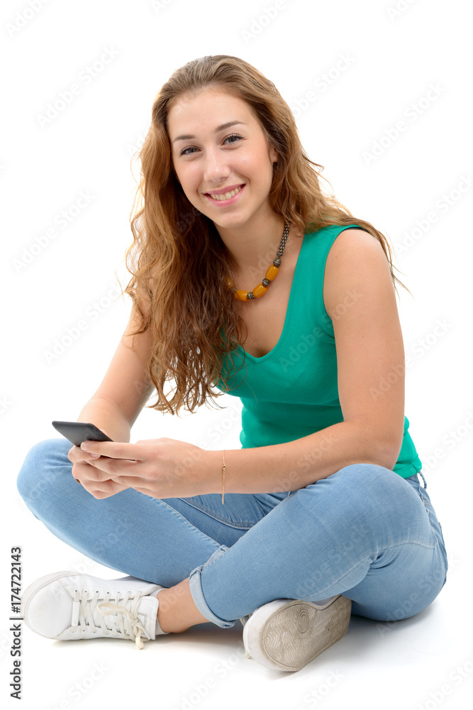 woman in green casual clothing, sitting crossed legs, holding smartphone woman in green casual clothing, sitting crossed legs, holding smartphone