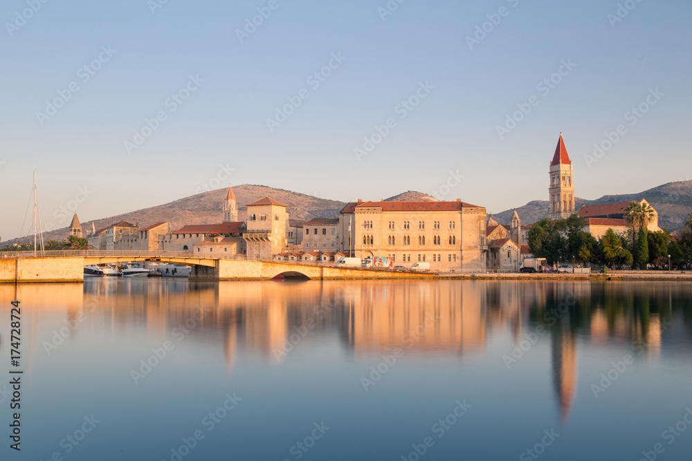Fototapeta premium Waterfront view of beautiful Trogir, Croatia - Unesco World Heritage Site. Image at sunrise.