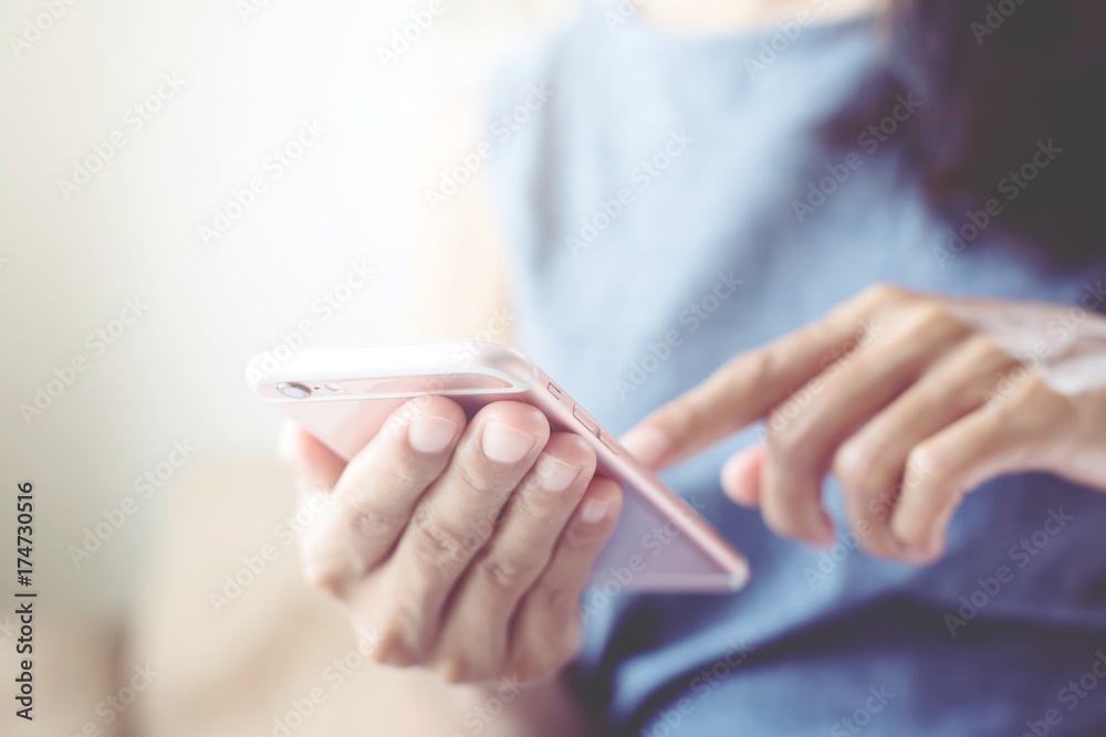 Lifestyle on a relaxing day  woman using cell phones to communicate in the online world. concept tone pastel color.