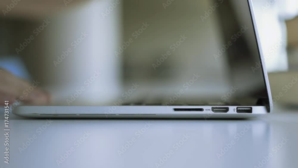 Close up of male hands open laptop and start working. Static shot Close up of male hands open laptop and start working. Static shot