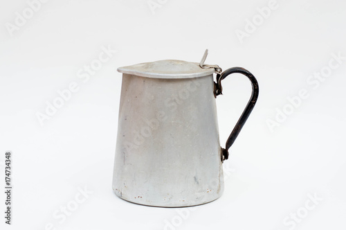 Aged tin kettle isolated