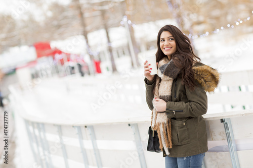 Pretty young woman drinking...
