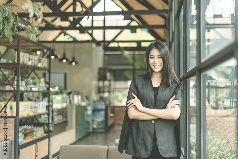 Modern business woman in the office with copy space, smiling business woman. Middle age beautiful and smiling business woman. Selective focus Modern business woman in the office with copy space, smiling business woman. Middle age beautiful and smiling business woman. Selective focus