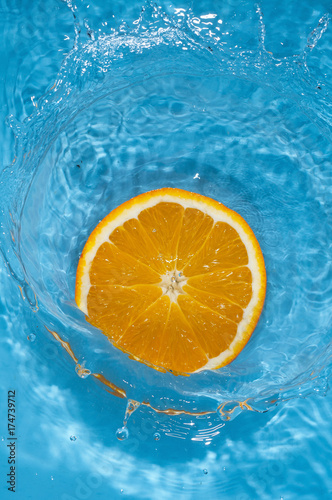 orange slice splash in the water