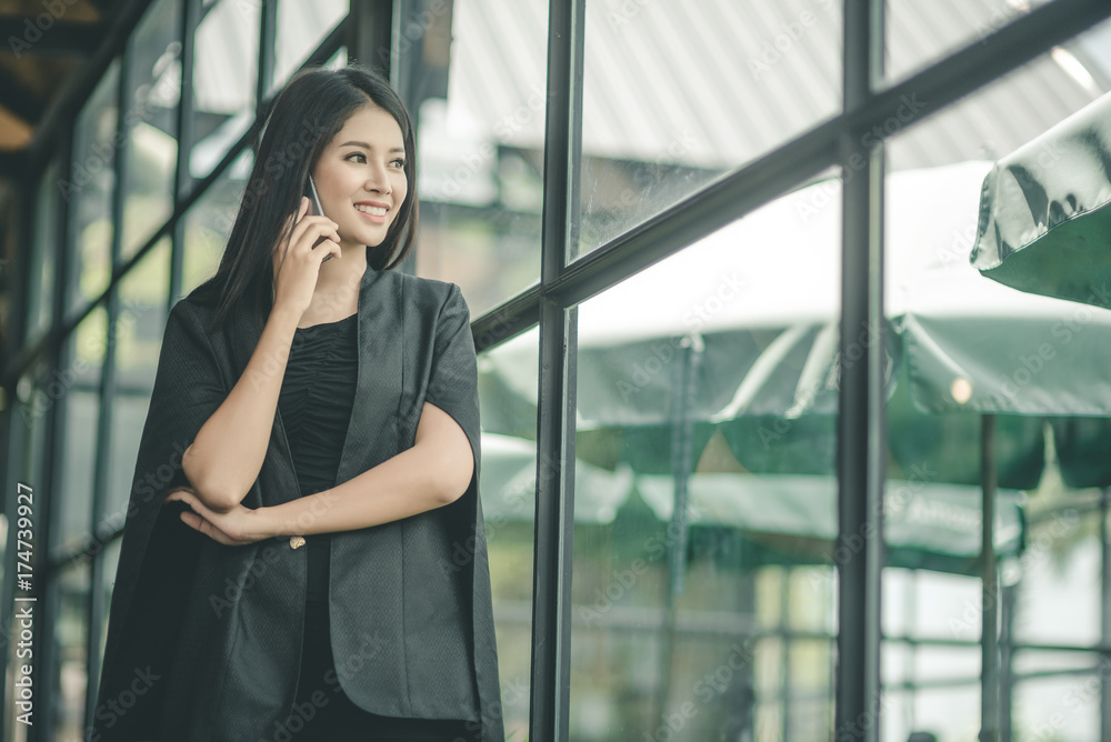 Modern business woman in the office with copy space, smiling business woman. Middle age beautiful and smiling business woman. Selective focus Modern business woman in the office with copy space, smiling business woman. Middle age beautiful and smiling business woman. Selective focus