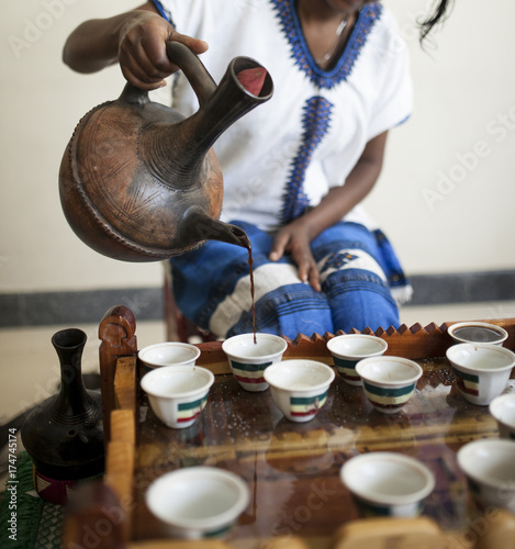 hand pouring Ethiopian coffee during coffee ceremony