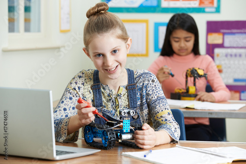 Portrait Of Female Pupil In Science Lesson Studying Robotics