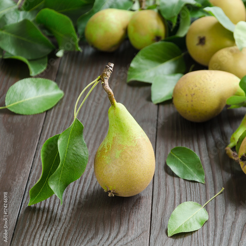 Pears on dark wooden background
