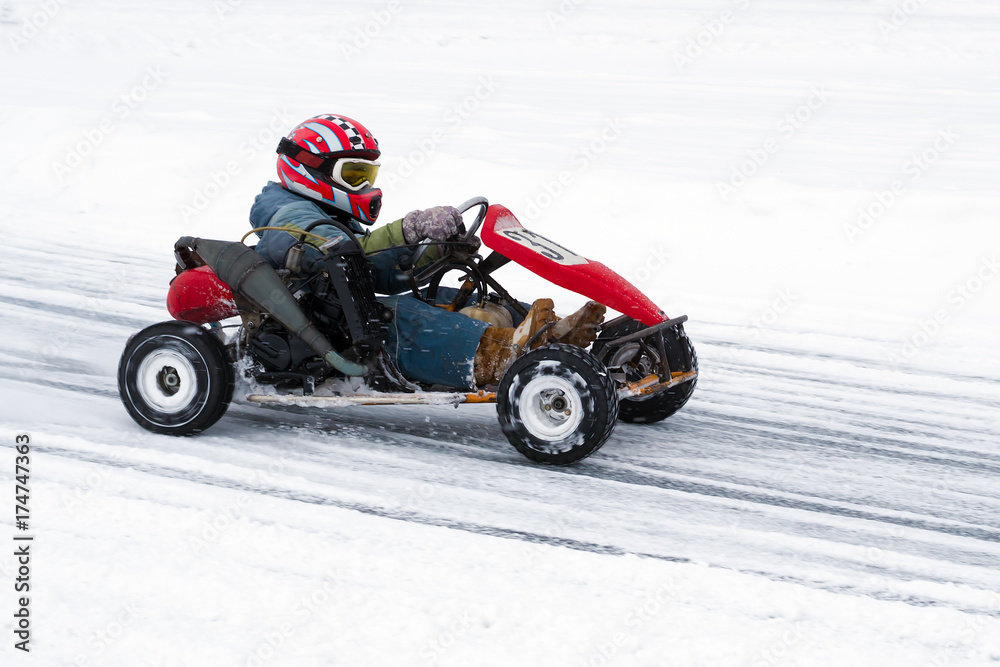 Winter karting competition on the ice track 