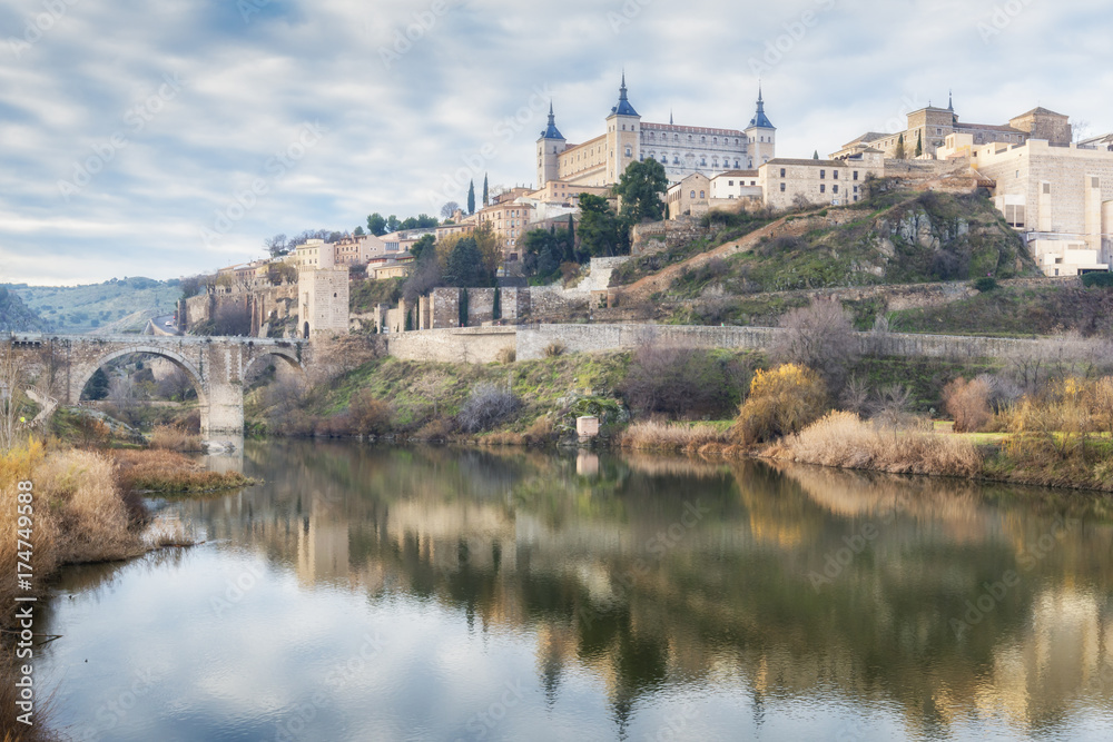 Historic City of Toledo with reflection in Tajo river. Castilla-La Mancha. Spain.
