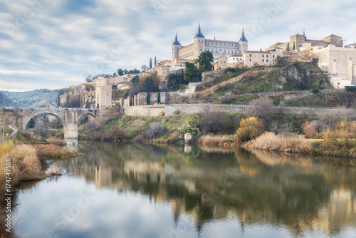 Historic City of Toledo with reflection in Tajo river. Castilla-La Mancha. Spain.