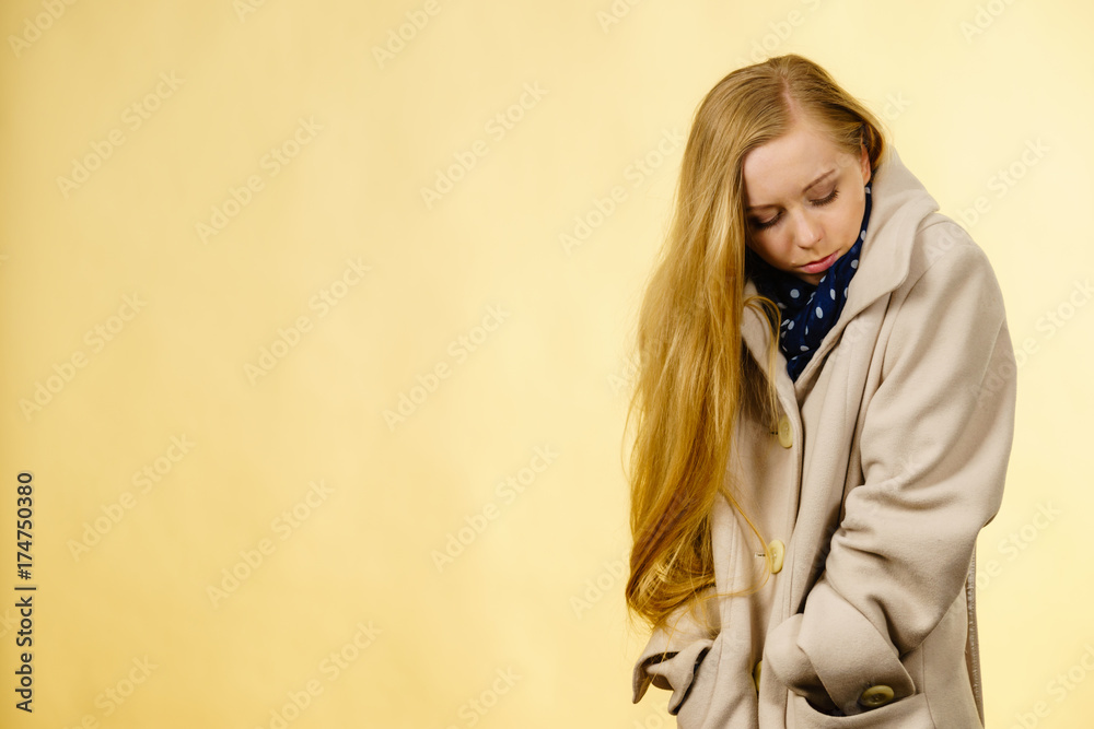 Woman wearing autumnal beige coat Woman wearing autumnal beige coat