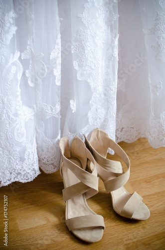bride shoes and wedding dress