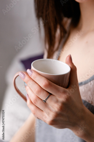 Good morning with cup of delicious tea. Meeting sunrise with favorite refreshment drink, enjoyment, calmness and romantic concept, close up picture