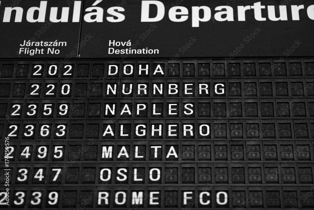 Departures board at the airport. Flight information mechanical timetable. Split flap mechanical departures board. Flight schedule Departures board at the airport. Flight information mechanical timetable. Split flap mechanical departures board. Flight schedule