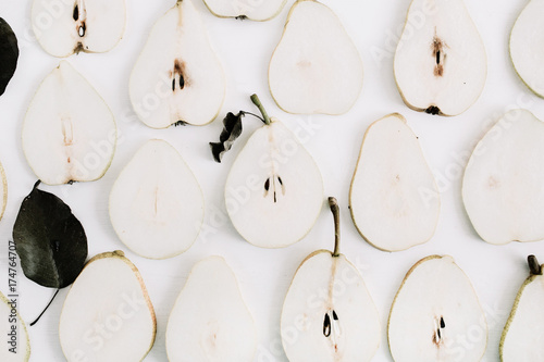 Pear slices pattern on white background. Flat lay, top view minimal concept.