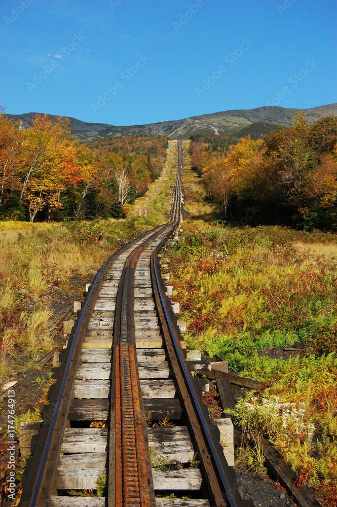 A Cog Train and rail in White Mountains in fall, New Hampshire, USA. A Cog Train and rail in White Mountains in fall, New Hampshire, USA.