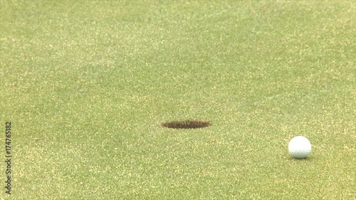 Short putt lips out while using golf alignment sticks