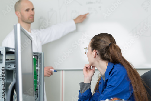 chemical teacher teaching students in the classroom