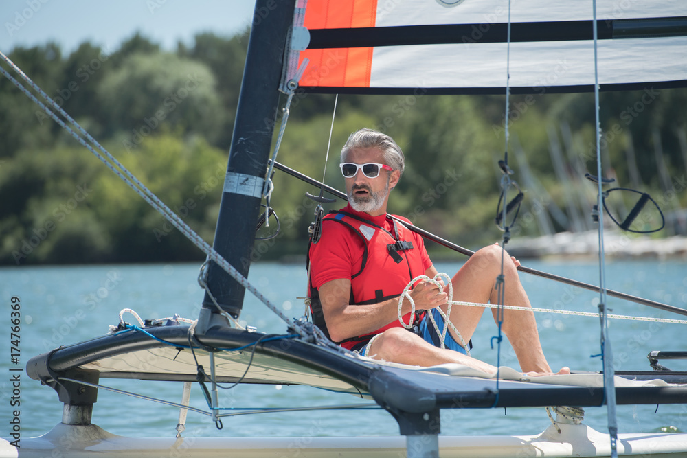 Fototapeta premium young man sailing