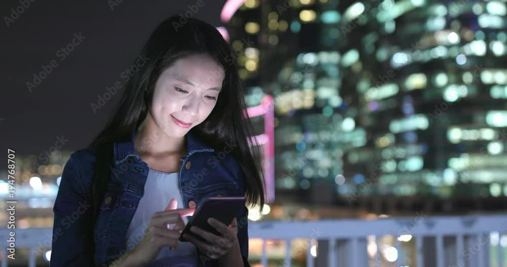 Woman use of smart phone at night Woman use of smart phone at night