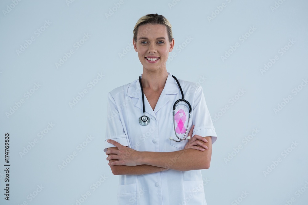 Portrait of female doctor with Breast Cancer Awareness ribbon Portrait of female doctor with Breast Cancer Awareness ribbon