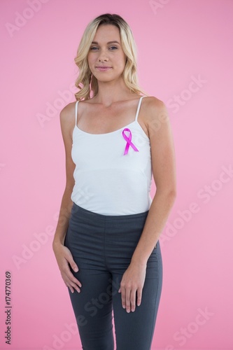 Portrait of happy young woman with Breast Cancer Awareness