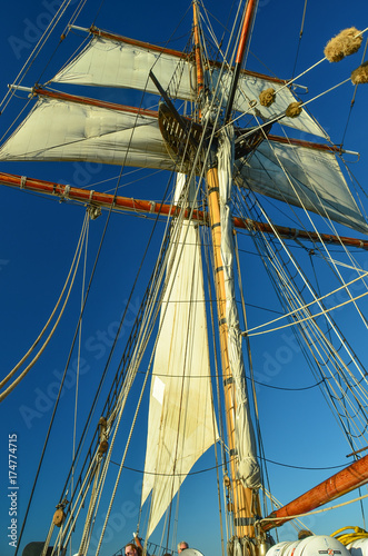 Bild auf Leinwand Working The Sails on Tall Ship Visiting Olympia Washington, USA, in Puget Sound
